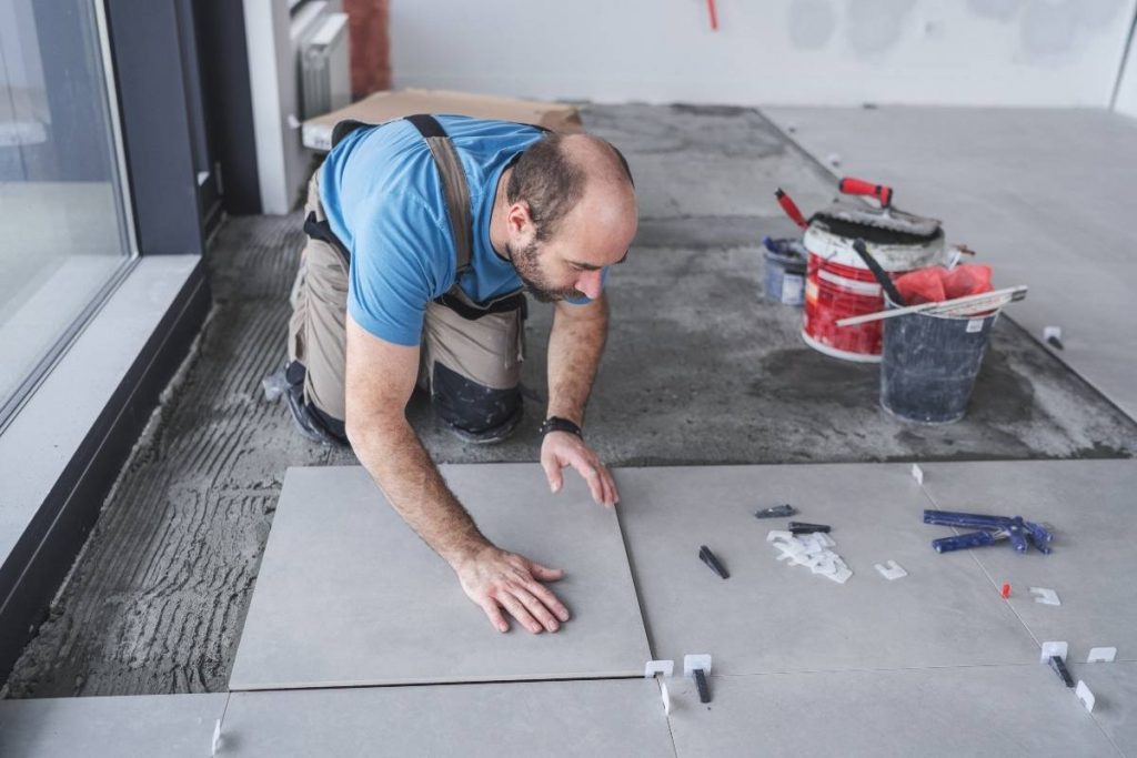 Install ceramic floor tiles