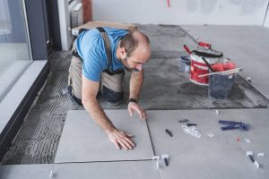 Install ceramic floor tiles